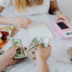 a woman creating a budget and learning how to budget your money